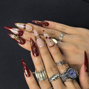 Cherry Bite retro glamour press-on nails – burgundy base with soft nude French tips and 3D cherry charm details