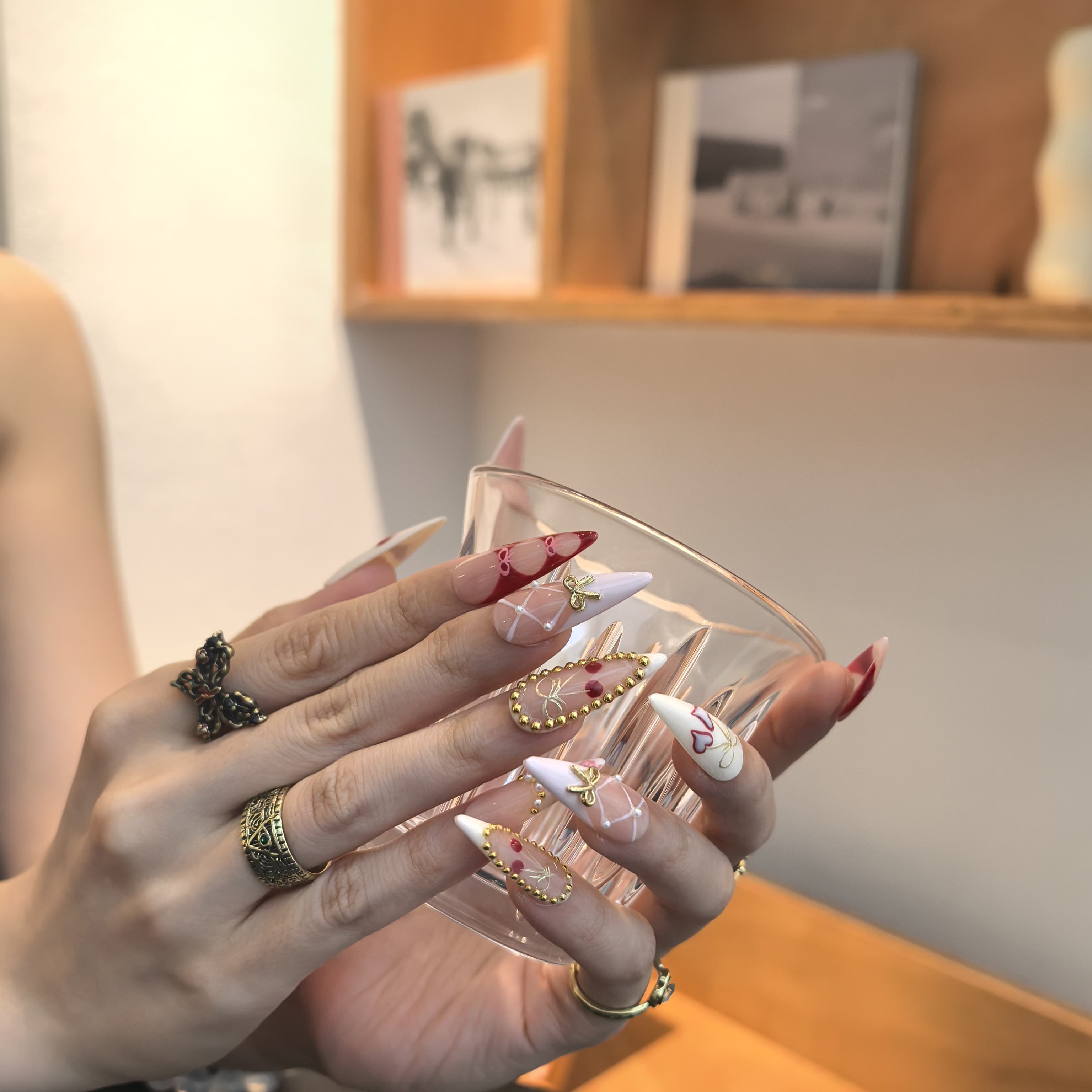 Cherry Pie press-on nails close-up – heart and bow nail art detail on white and pink bases
