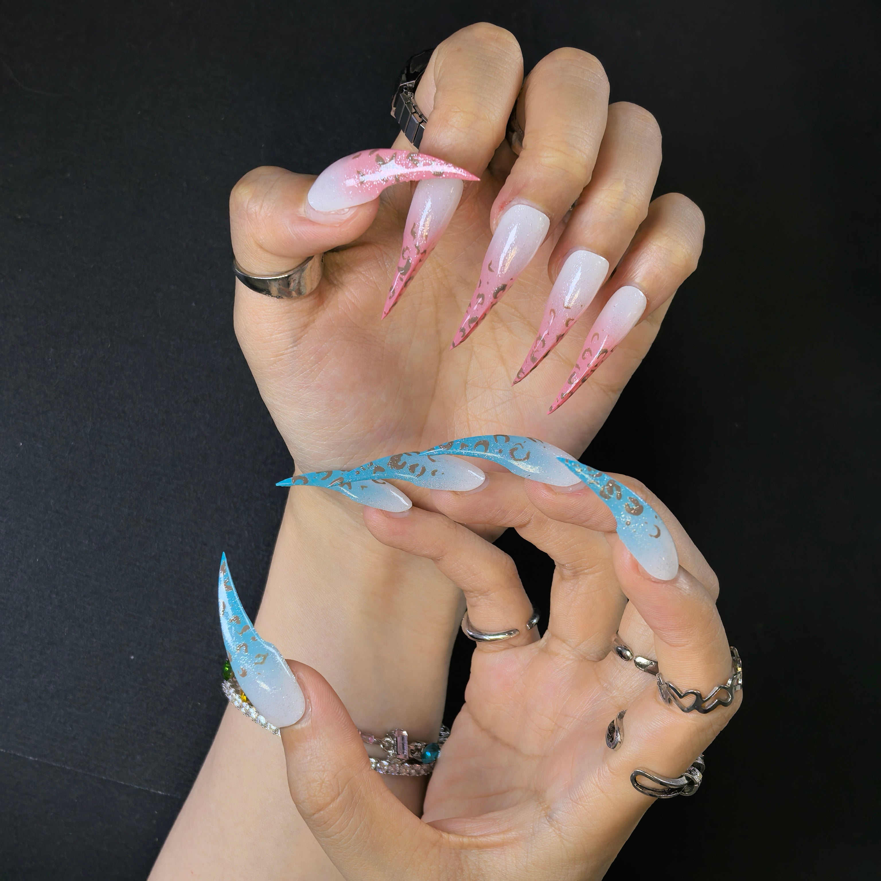 Close-up of Cat Claw #15 press-on nails — white to blush pink and silver glitter to turquoise dual ombré gradient brown leopard spot nail art by Poorguyshop