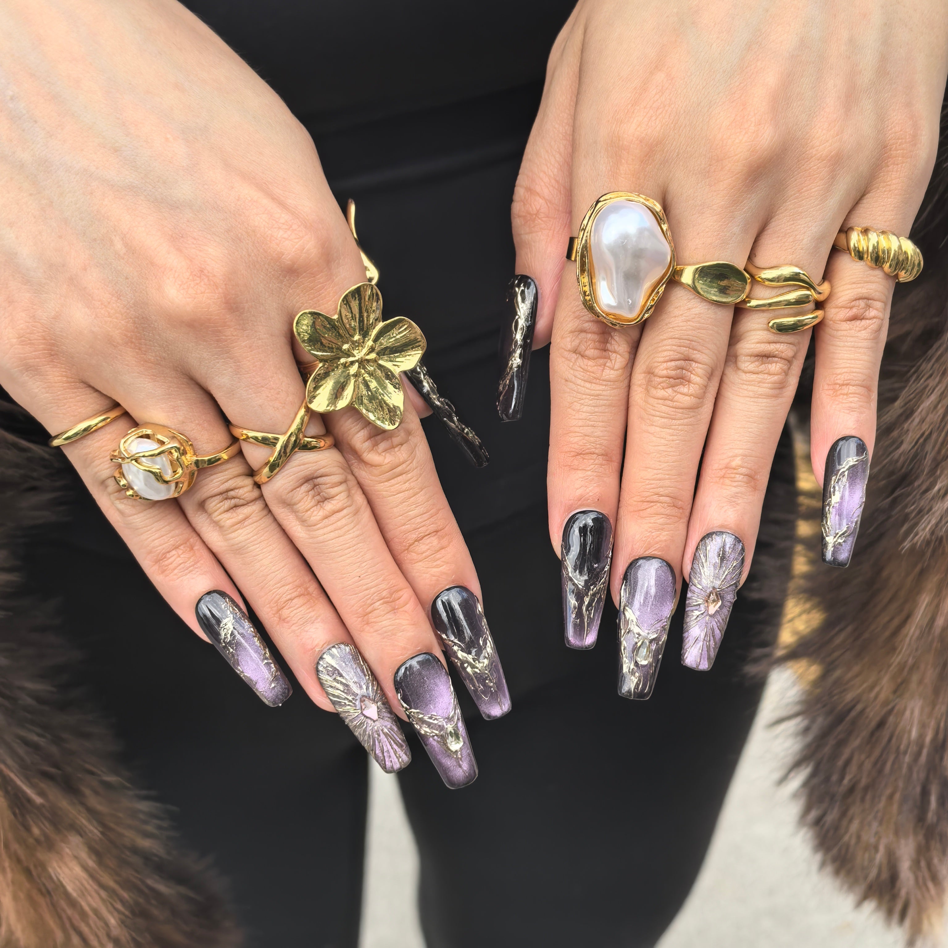 Close-up of Purple Lux press-on nails — purple black nebula glitter gold vein texture faceted gem fan detail nail art by Poorguyshop