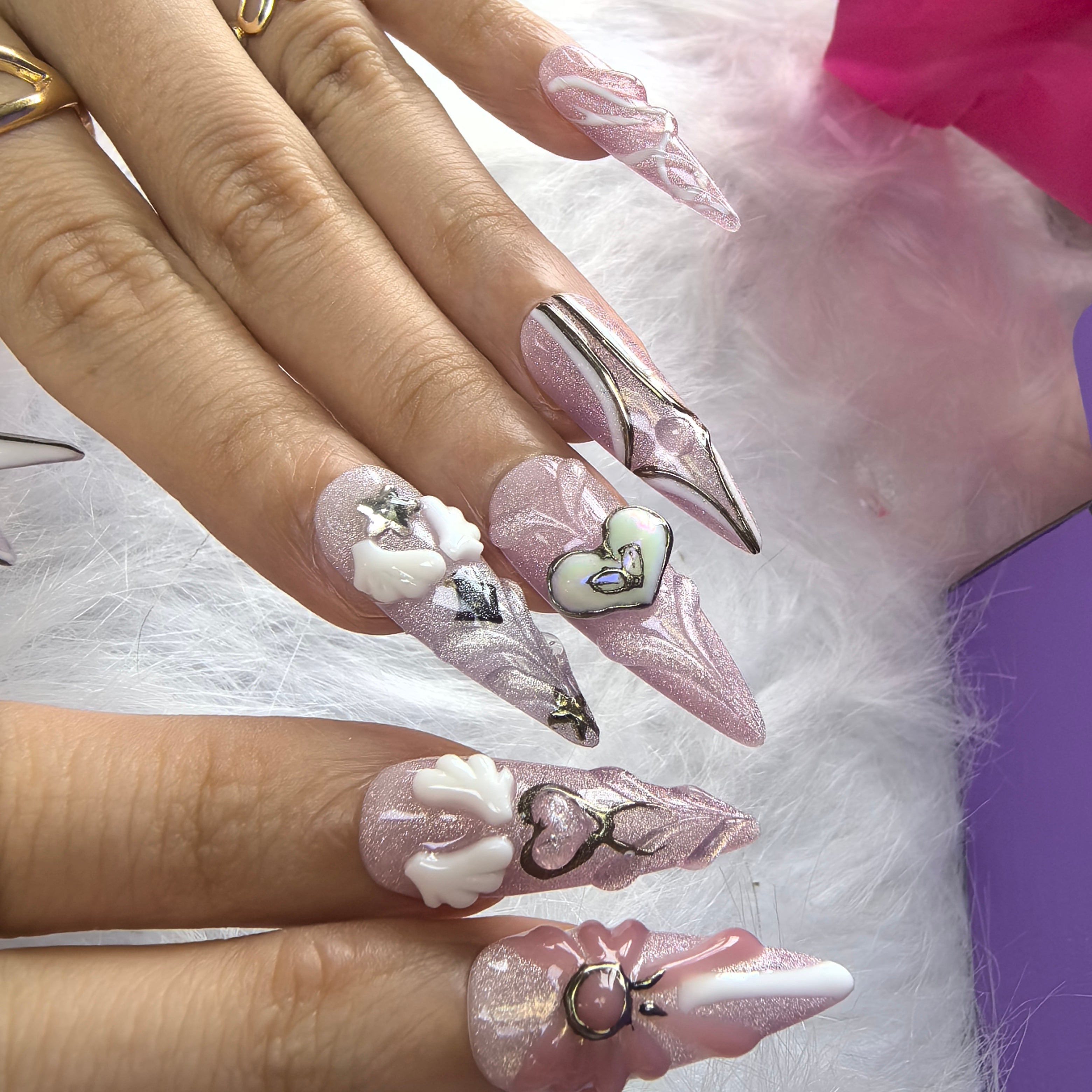 Close-up of Sailor Moon press-on nails — 3D pink bow charm heart gem silver metallic outline opal accent nail art by Poorguyshop