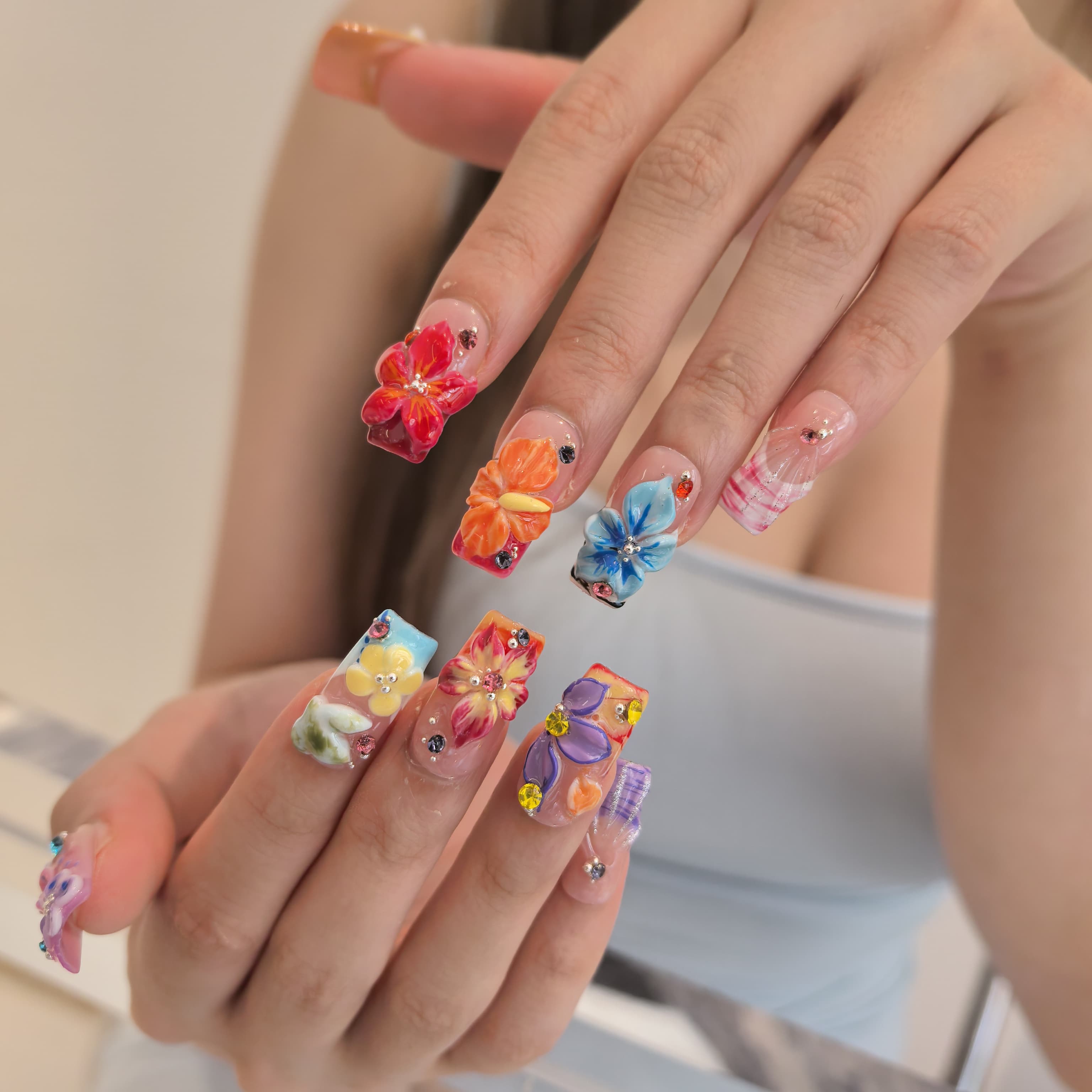 Coral Blossom press-on nails close-up – sparkling gemstone accents and 3D floral embellishments on coffin nails, 25–30mm