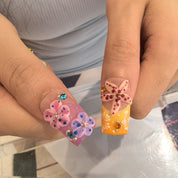 Coral Blossom tropical coffin nails – delicate daisy prints and playful stripe details with bold 3D flower nail art