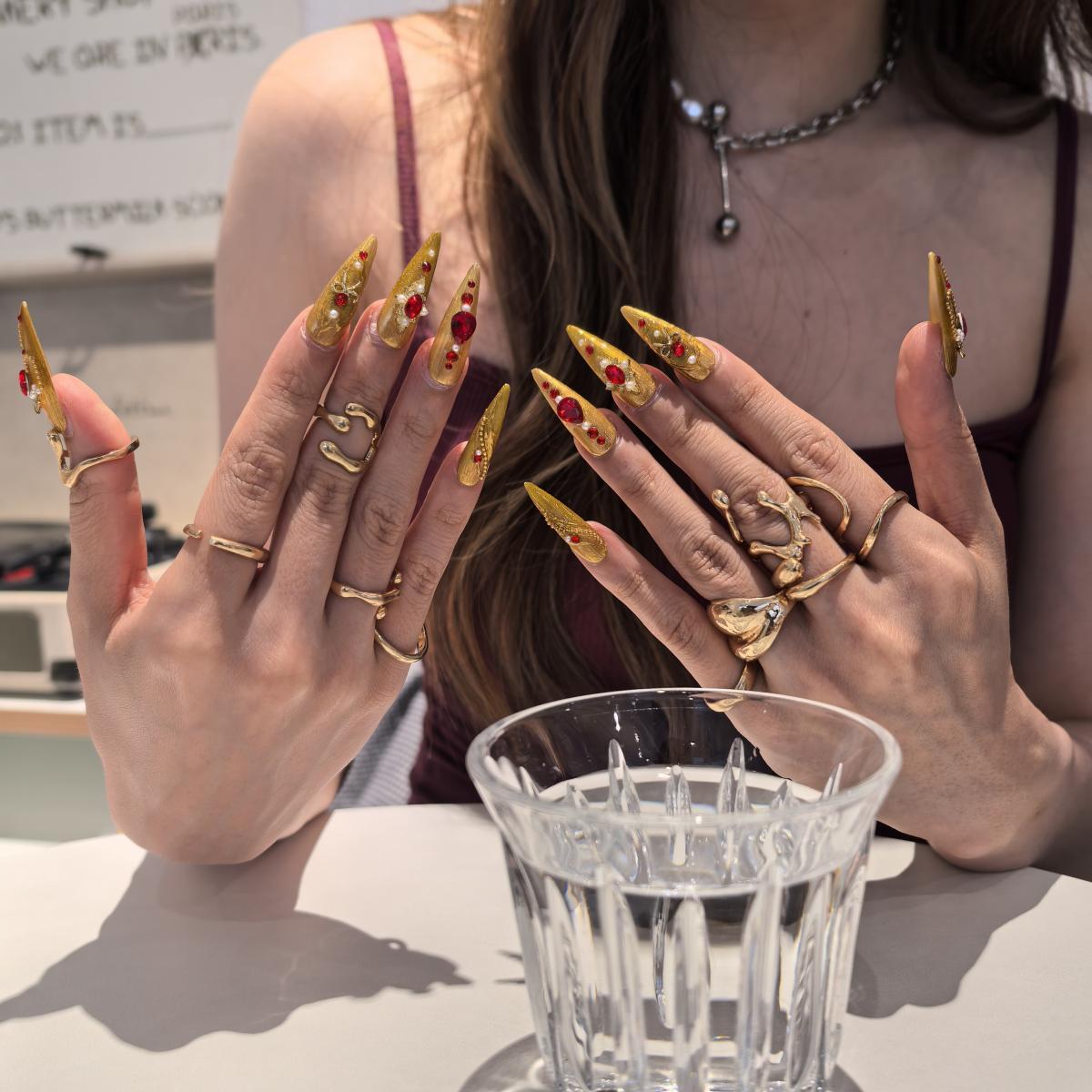 Golden Armor 30mm stiletto press-on nails — hand-painted gold red gemstone luxury fake nails for women