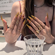 Golden Armor 30mm stiletto press-on nails — hand-painted gold red gemstone luxury fake nails for women