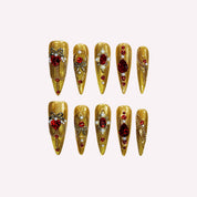 Golden Armor handmade press-on nails — gold red gemstone pearl nail art set in coffin and stiletto shapes by Poorguyshop