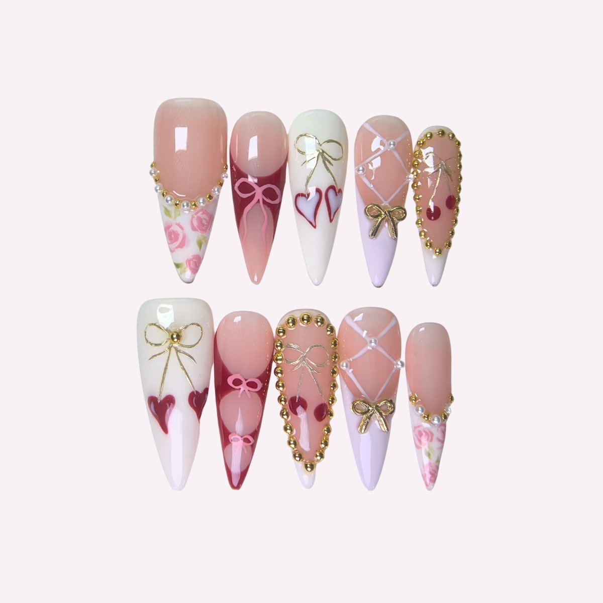 PoorGuyShop Cherry Pie handmade stiletto press-on nails – bow and heart motifs on nude, pink and purple bases with pearl accents