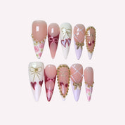 PoorGuyShop Cherry Pie handmade stiletto press-on nails – bow and heart motifs on nude, pink and purple bases with pearl accents