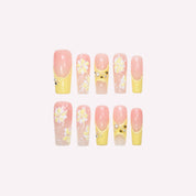 PoorGuyShop Southern Belle handmade squoval press-on nails – translucent pink base with yellow French tips and 3D floral accents