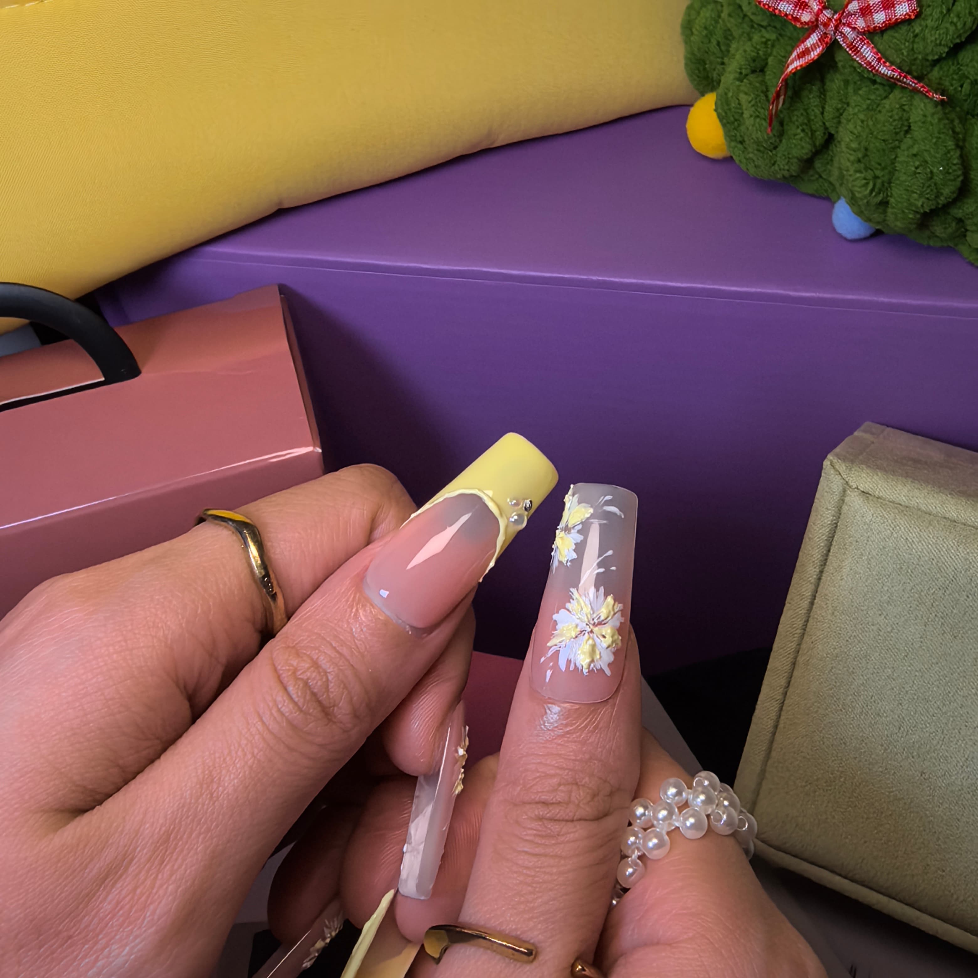 Southern Belle squoval press-on nails – tiny rhinestone details and yellow floral art on soft pink translucent base