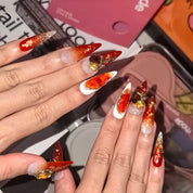 Twilight Ember 30mm stiletto press-on nails — hand-painted ruby red gold gradient citrine gem gold foil luxury fake nails for women