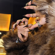 Woman wearing Cat Claws #3 handmade press-on nails — smoky glitter claw nails dark glam by Poorguyshop