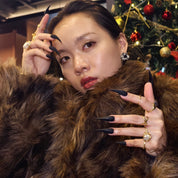 Woman wearing Cat Claw #4 handmade press-on nails — all-black claw nails dark minimalist by Poorguyshop