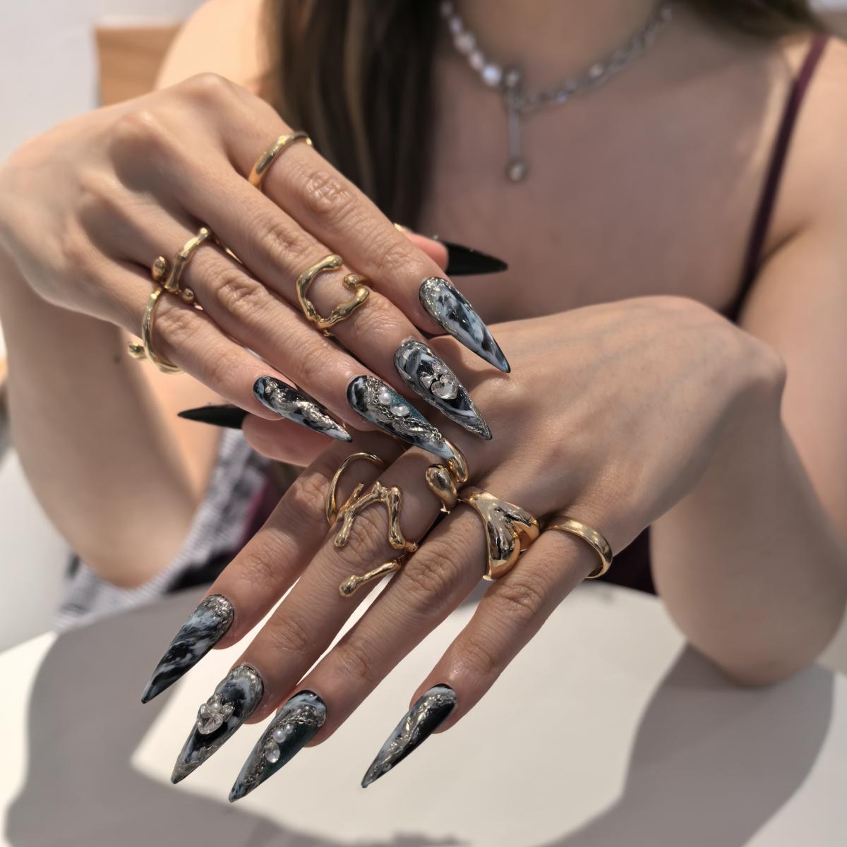 Woman wearing Palace handmade press-on nails — dark gothic swirl nail art coffin stiletto by Poorguyshop