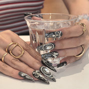 Woman wearing Pearlescence handmade press-on nails — pearl white iridescent nail art coffin stiletto by Poorguyshop