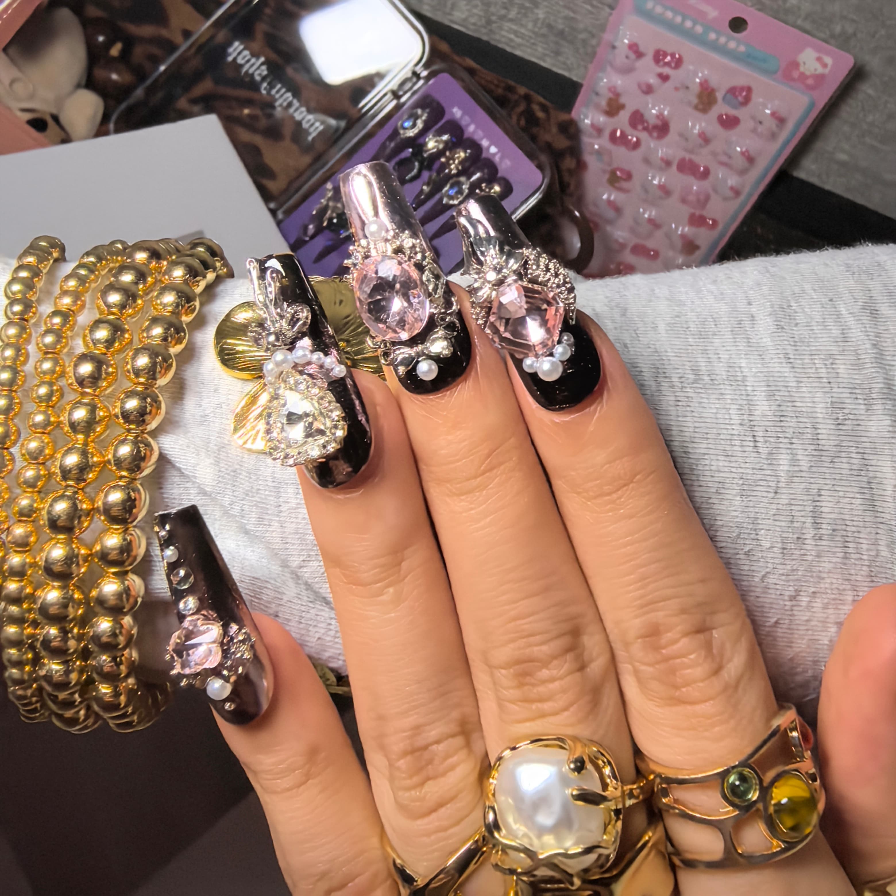 Woman wearing Pink Saturn handmade press-on nails — dusty rose antique gold baroque velvet rose nail art coffin by Poorguyshop