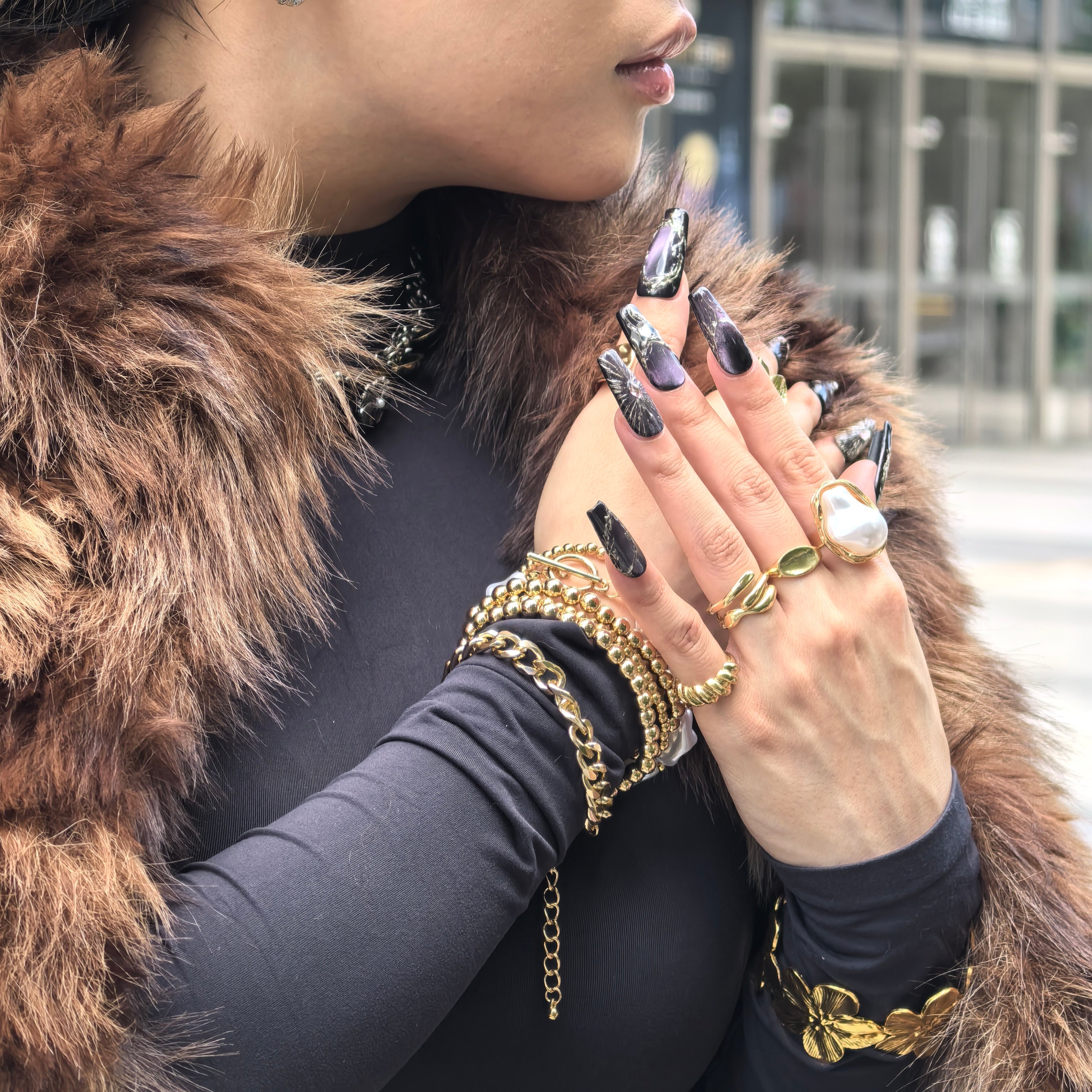 Woman wearing Purple Lux handmade press-on nails — purple black gradient gold vein gem nail art coffin stiletto by Poorguyshop