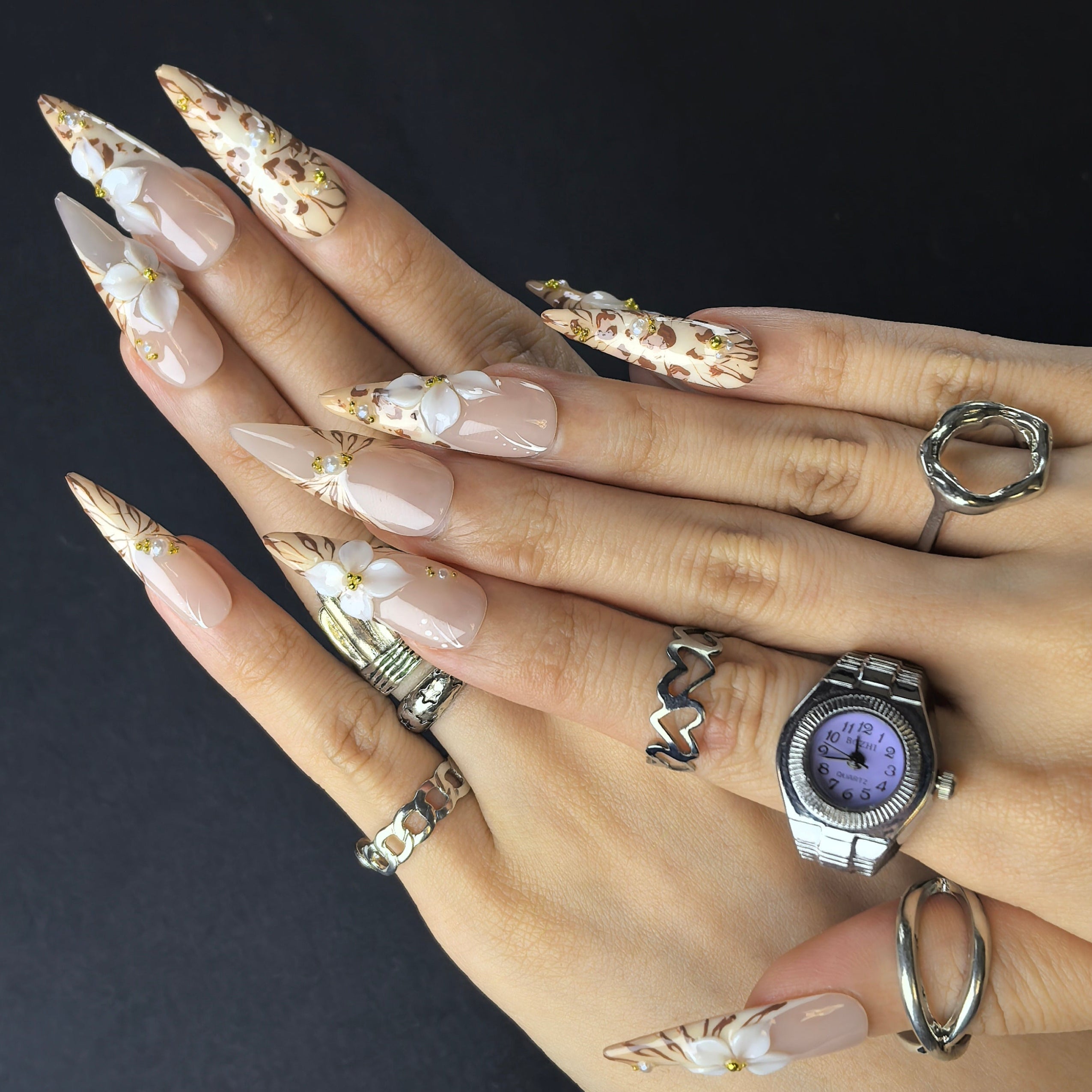 Woman wearing Riverdale Wild handmade press-on nails — bold nail art in coffin stiletto shape by Poorguyshop
