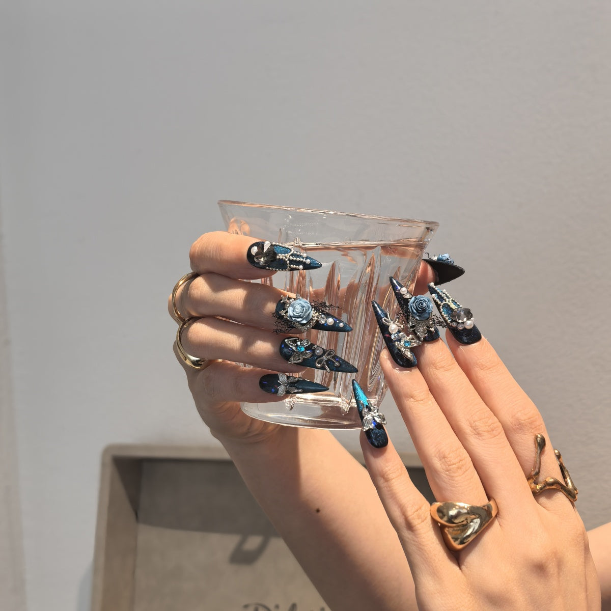 Woman wearing Witch handmade press-on nails — dark purple moon mystical nail art coffin stiletto by Poorguyshop