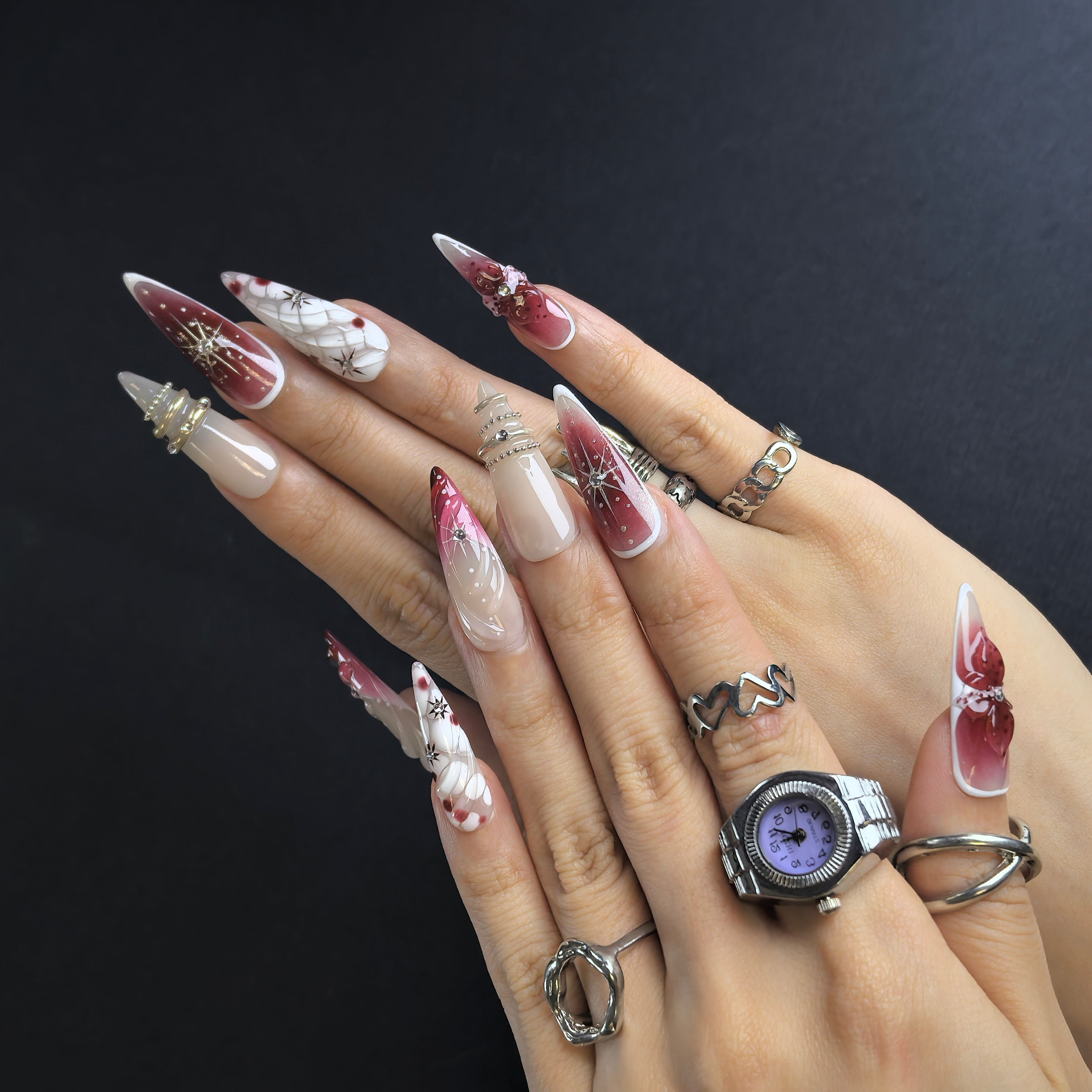 Woman wearing Wine Starlight handmade press-on nails — burgundy starlight nail art coffin stiletto by Poorguyshop